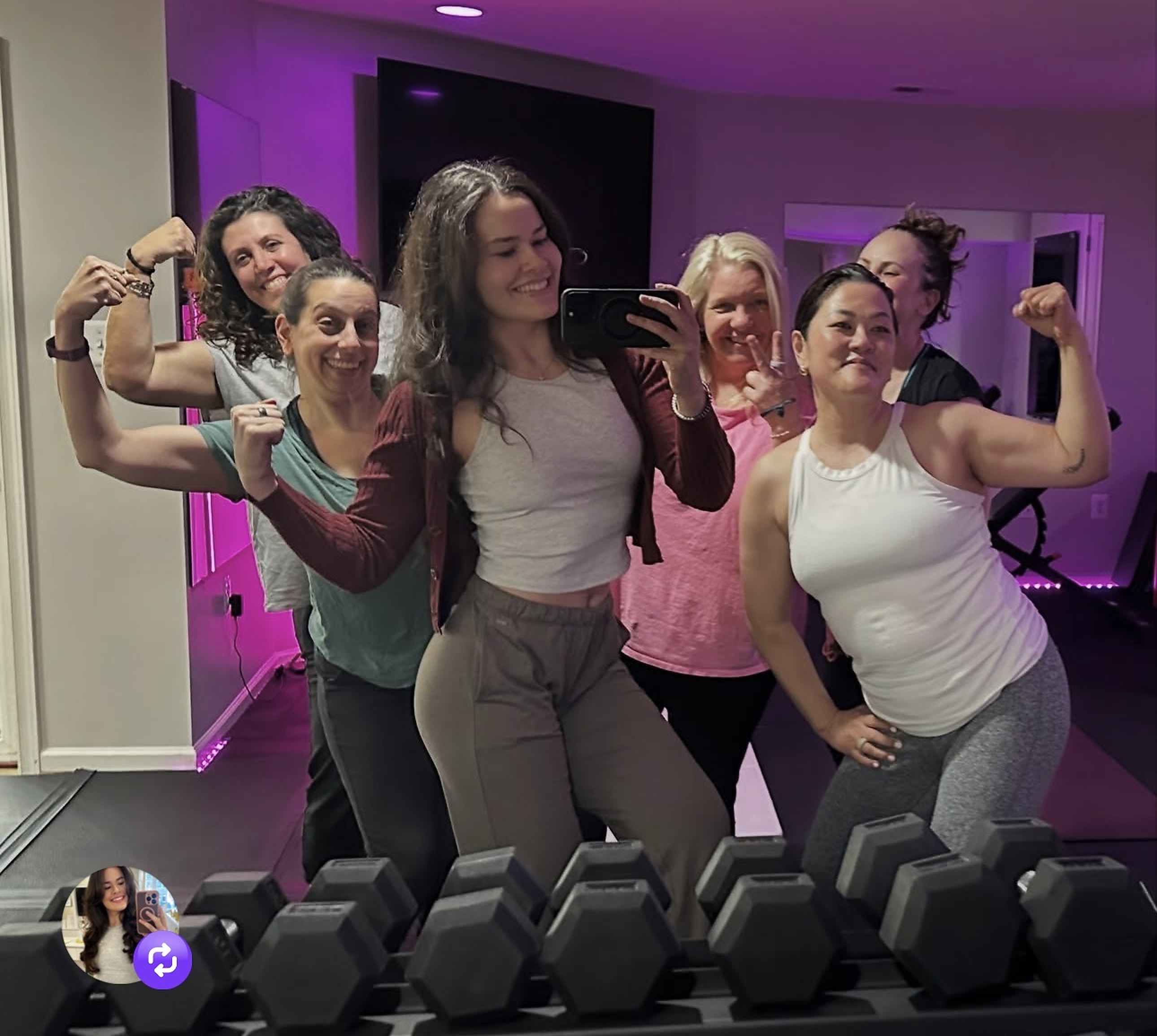 Strong & Healthy members flexing together after a small group strength session